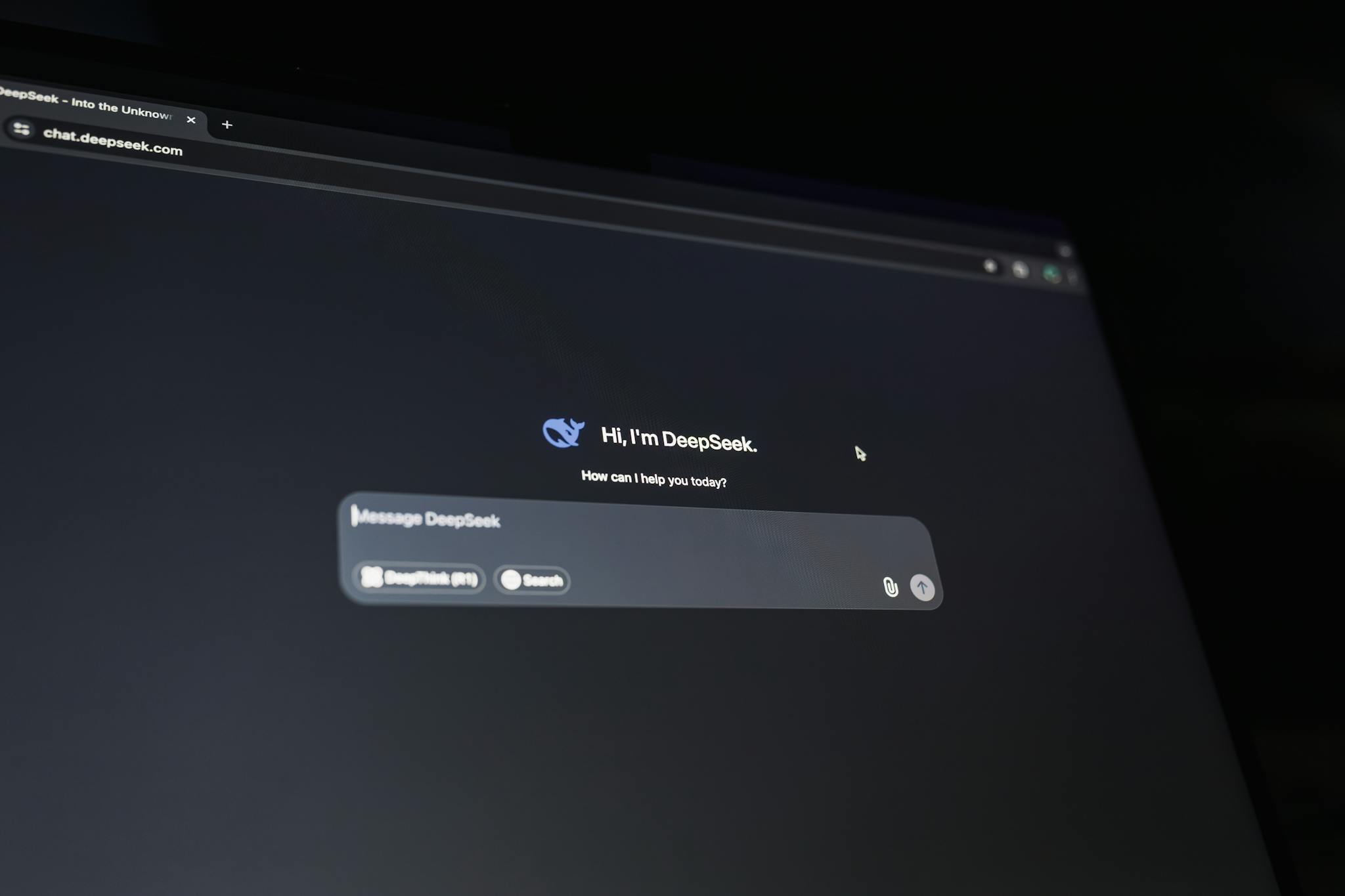 A dark-themed chat interface displaying an AI assistant conversation starter on a screen.